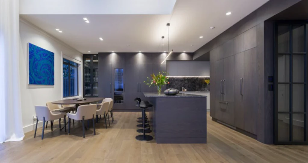 The open kitchen treats guests and residents to an array of contrasting colours and materials.