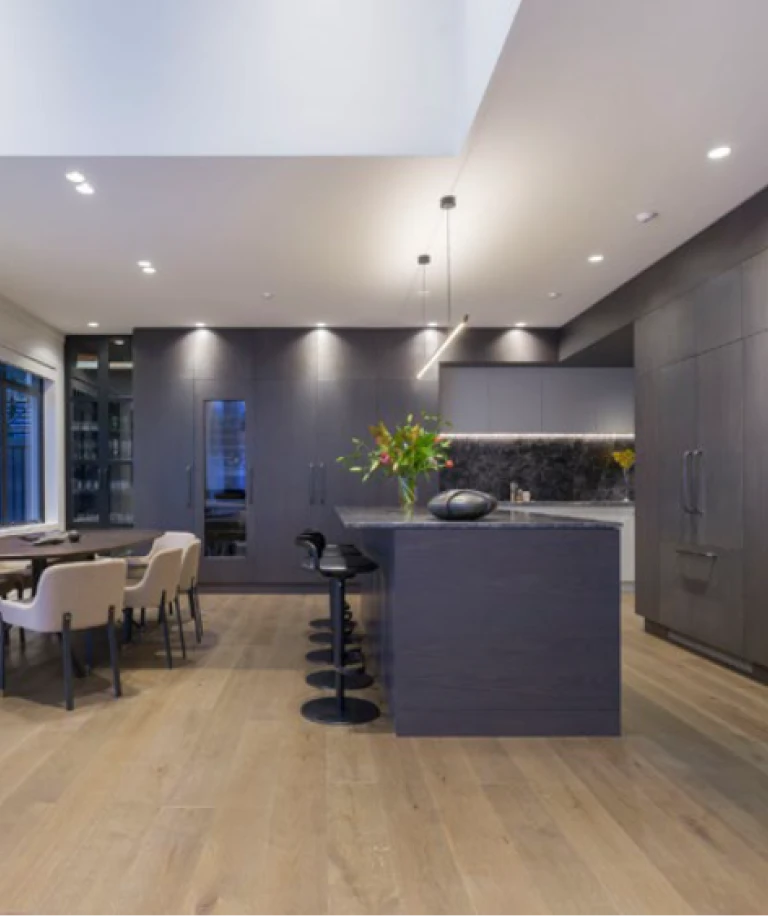 The open kitchen treats guests and residents to an array of contrasting colours and materials.