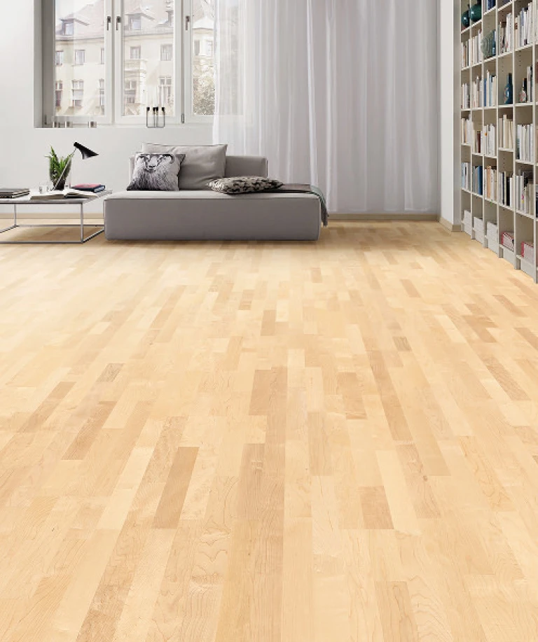 Bild von einem Wohnzimmer mit einem HARO Parkettboden aus Ahorn