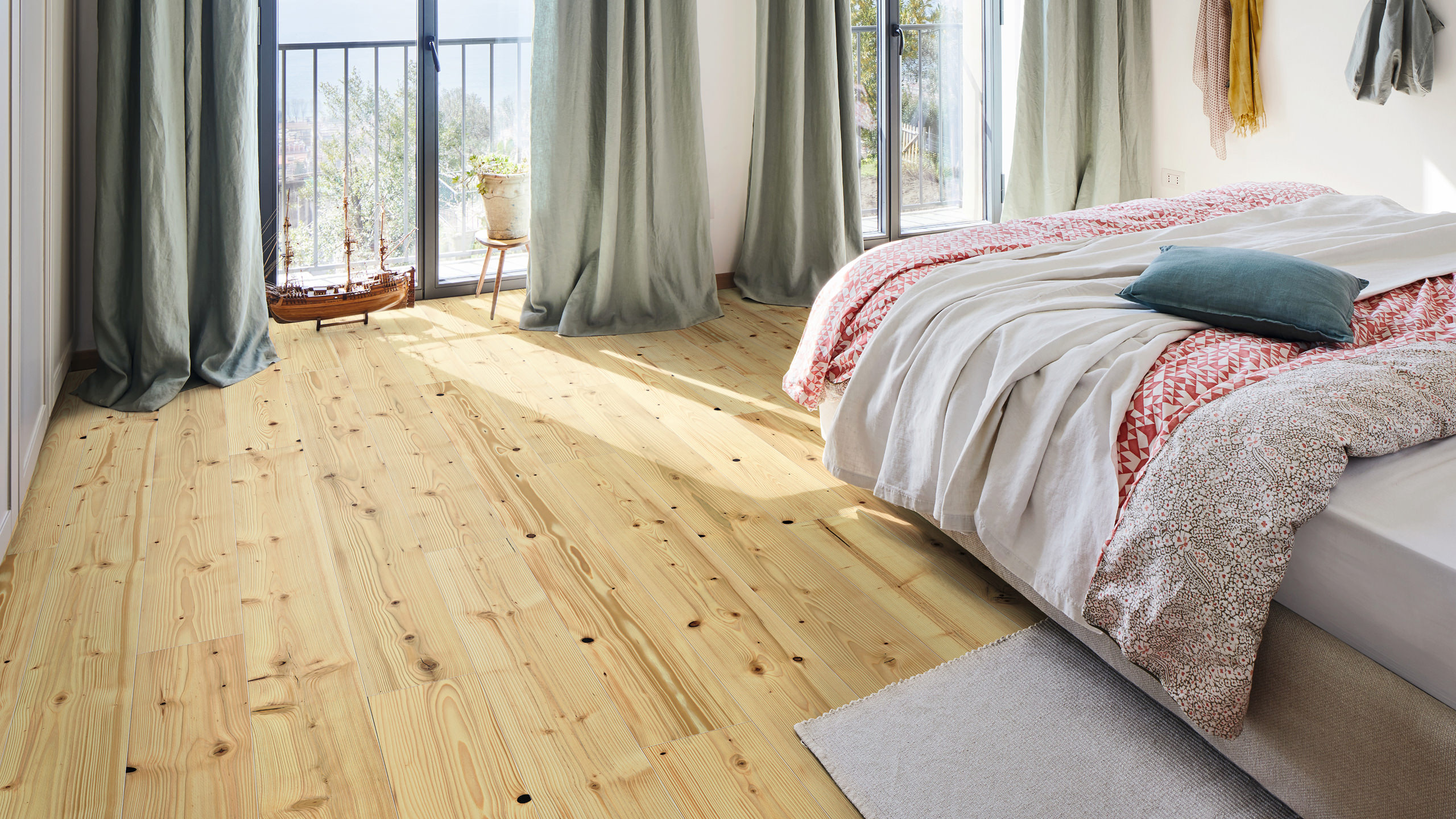 A bedroom with HARO parquet flooring made from fir wood