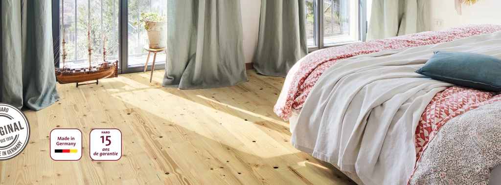 Une chambre à coucher avec HARO Parquet en sapin