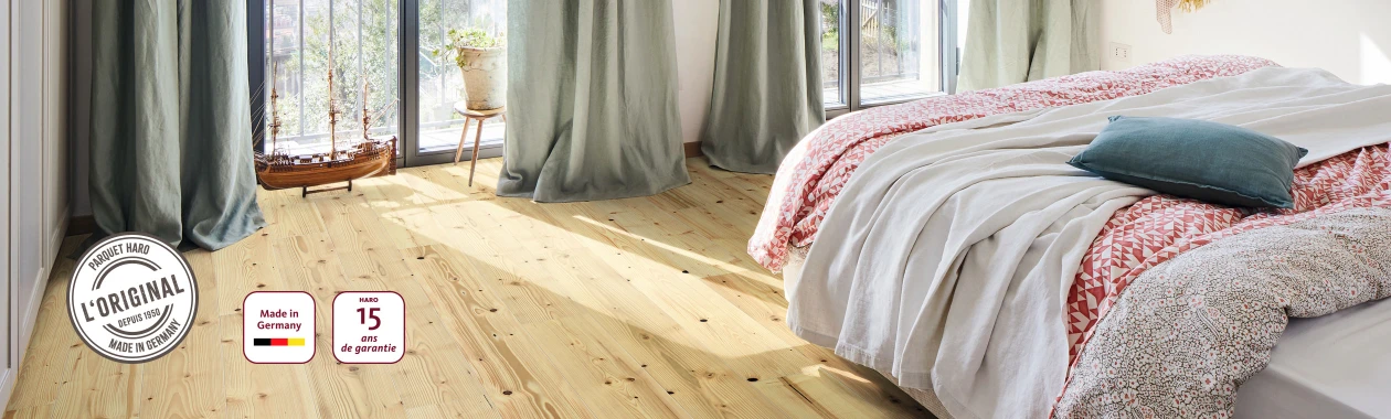 Une chambre à coucher avec HARO Parquet en sapin