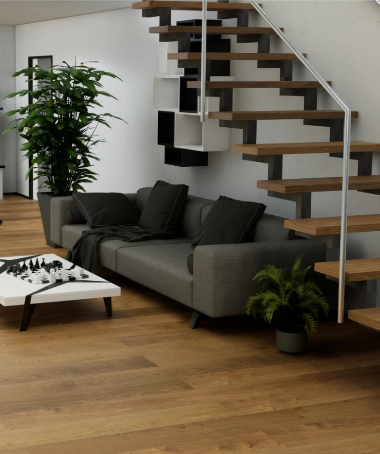 Großzügiges Wohnzimmer mit braunem HARO Parkettboden, der einheitlich auch auf der Treppe verlegt ist.