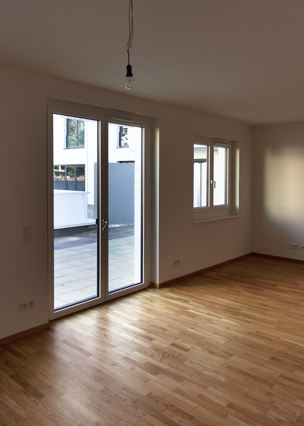 HARO parket 3-stavs gulv 4000 eg Tundra  i den modstandsdygtige permaDur-lakering blev anvendt i de 134 boliger